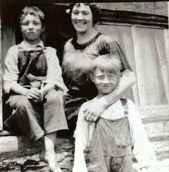 Wayne Knapp, Robert Knapp, and Nonie Knapp standing by the barn in Taylor Rapids, Wisconsin, photo copyright the Knapp Family estate