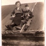 Nora Knapp on the roof of the old log cabin with brother Wayne, circa 1923