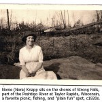 Nora Knapp on shores of Peshtigo River at Strong Falls, Taylor Rapids, circa 1920s