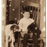 Wayne Knapp in chair next to dog, Taylor Rapids, Wisconsin, circa 1920